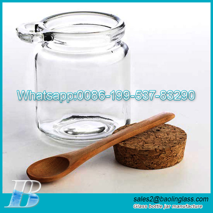 https://www.baolinglass.com/wp-content/uploads/2021/02/Wholesale-Body-Scrub-Jars-Honey-Glass-Bottle-Vial-Spice-Jar-With-Cork-Lid-Wooden-Spoon.jpg