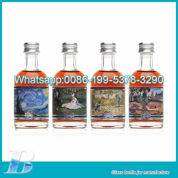 Wholesale Mini 50ml glass liquor bottles with caps tamper evident alcohol mini bottles for cocktails small bottels for maple