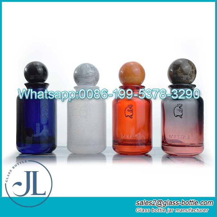 Wholesale 50ml cylinder colored glass spray perfume bottle supplier